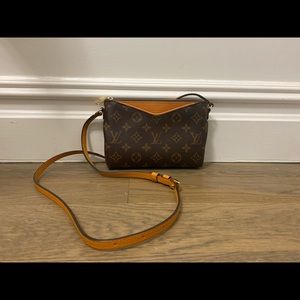 Employee version of Louis Vuitton Pallas Clutch